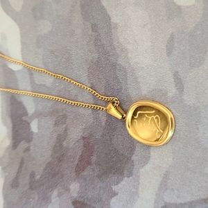 Female line art pendant gold necklace